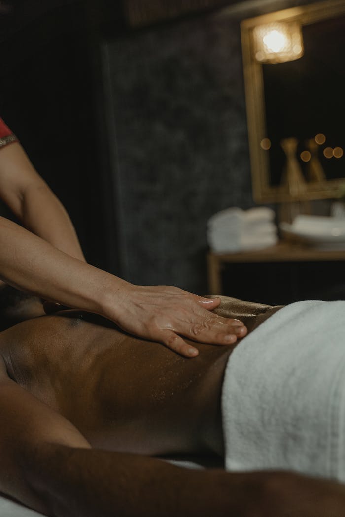 A soothing massage session promoting relaxation and wellness at a spa.