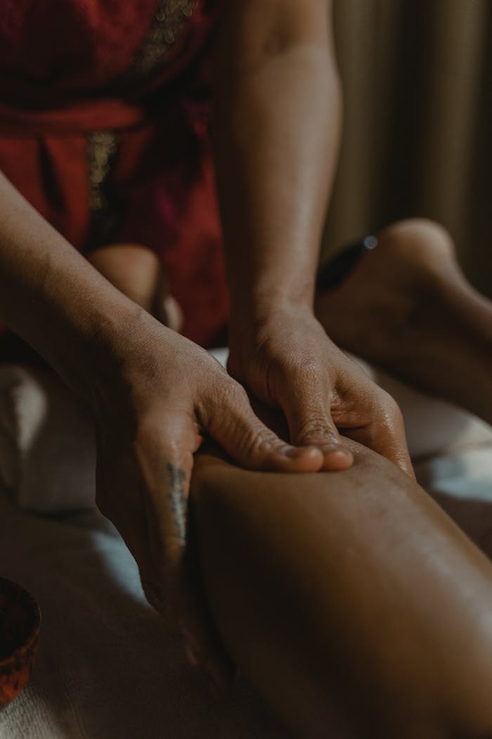 Close-up of a relaxing massage session highlighting therapeutic hand techniques in a spa setting.